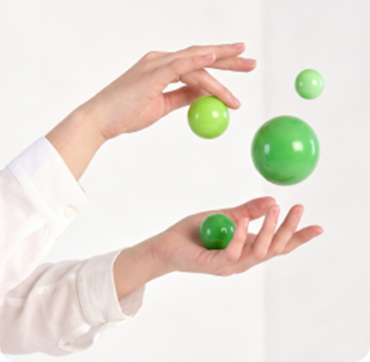 Hands holding green orbs