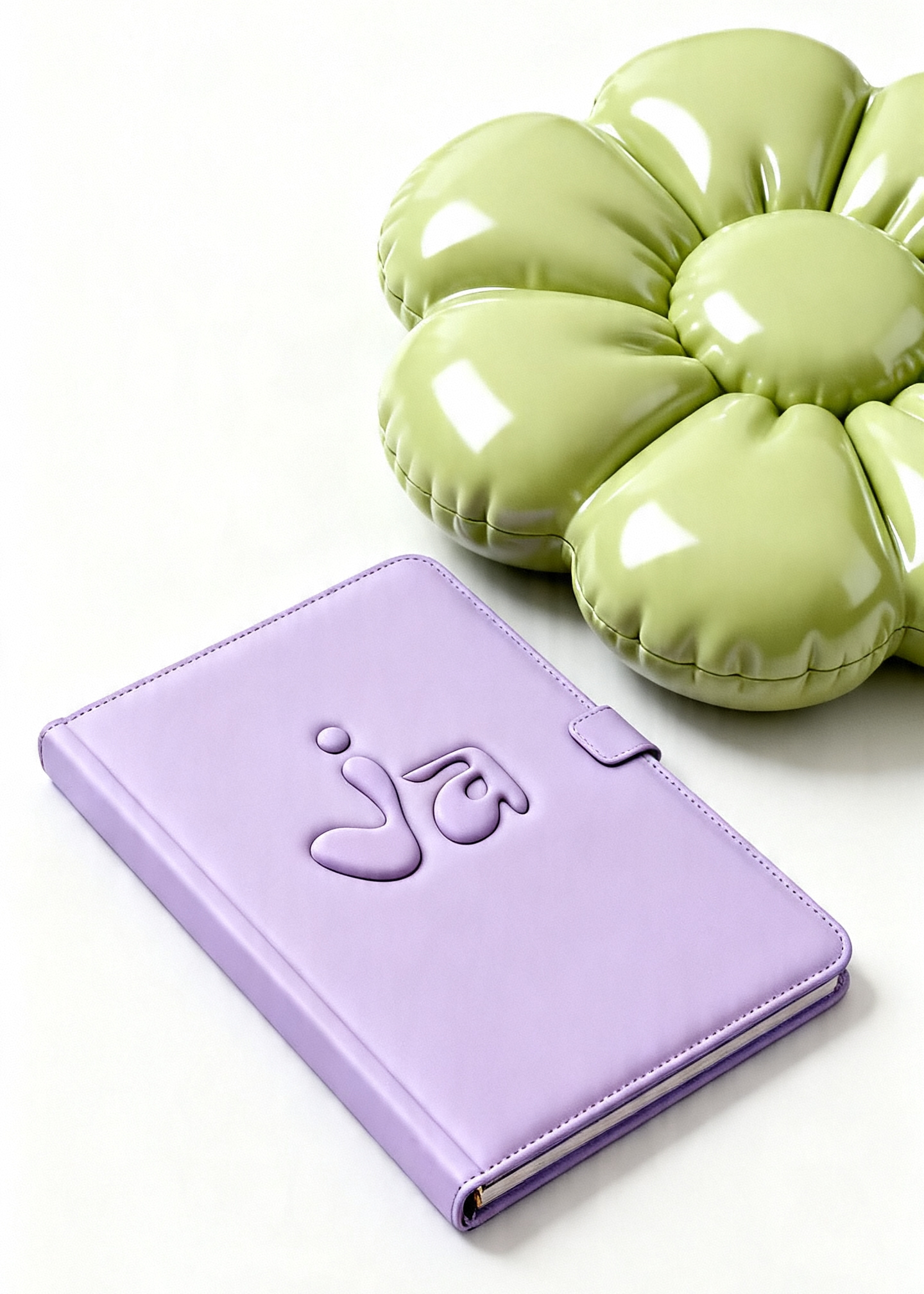 Ja logo embossed on a purple notebook